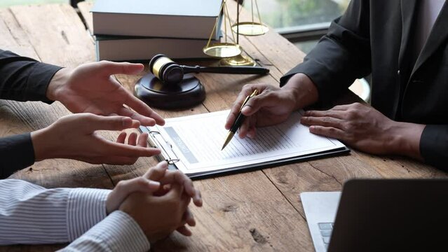 Attorneys or lawyers who are reading the statute of limitations Consultation between male lawyers and business clients, tax and legal and legal services firms.