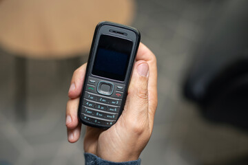 Old school PDA device with stylus from early 2000s and millennium 