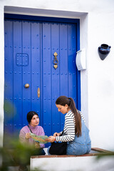 girls locating themselves with map in town
