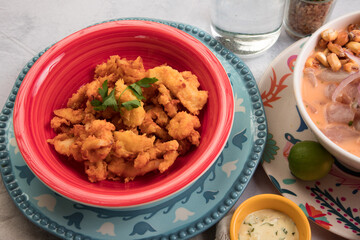 Chicharron de pota chicharron fish sticks Sea food ceviche Assorted food plates Peru traditional comfort food buffet table