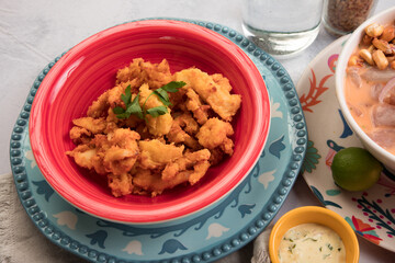 Chicharron de pota chicharron fish sticks Sea food ceviche Assorted food plates Peru traditional comfort food buffet table