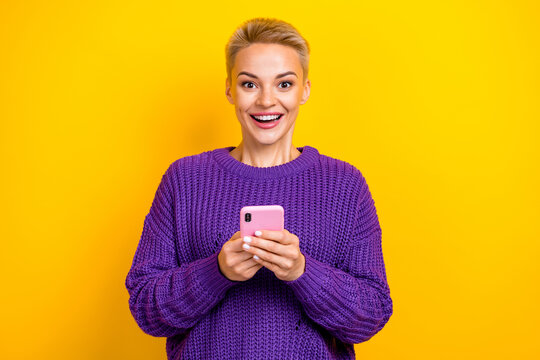 Photo of excited surprised new smartphone use new gadget young woman good emotion eshopping black friday isolated on yellow color background - Powered by Adobe