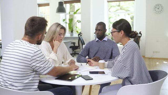 Business multi-ethnic team working together in a meeting.