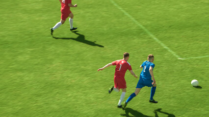 Stadium Soccer Football Match International Championship: Blue Team Attacks, Plays in Pass, Dribbling. World Tournament. Live Sport Broadcast Channel Television Concept. High Angle Shot.