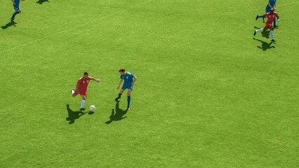 Professional Soccer Football Match Championship: Red Team Attacks, Plays in Pass. Major League Cup World Tournament. Live Sport Broadcast Channel Television Concept. High Angle Shot.
