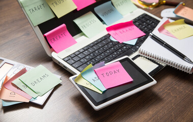 Laptop computer with colorful sticky notes. Business