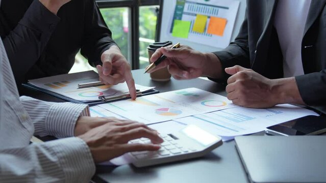 Financial analyst analysis business financial report on digital tablet during discussion at meeting of corporate showing the results of their successful teamwork., business meeting concept, Marketing	
