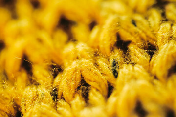 Closeup of yellow knitted yarn