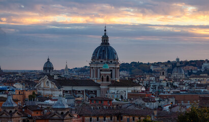 Fototapeta na wymiar Old Historic Buildings in Downtown City of Rome, Italy. Cloudy Sunny Sunset Sky.