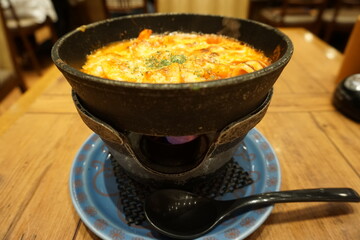 Seafood doria. Doria is a popular Japanese oven baked dish consisting of rice topped with bechamel sauce and grated cheese
