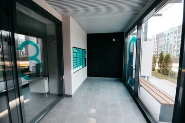 The entrance to the modern apartment house. An intercom and a collection post are installed