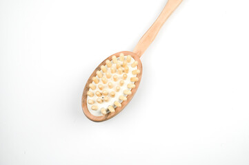 Wooden massage brush. Bath massage scrub brush. Spa at home concept. Zero waste