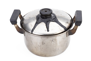 A stainless steel pot with burnt marks closed lid from being left on the stove.