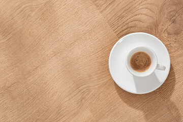 Small Coffee Cup on Oak Desk