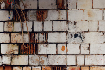 Close up of a brick wall in a bad condition.
