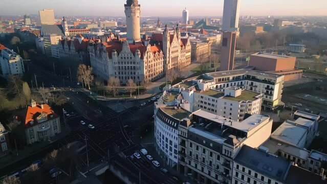 Aerial view of the German city Leipzig in Saxony during the sunrise. Drone footage during golden hour. 4K