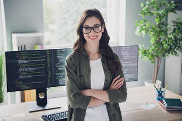 Photo of happy confident lady programmer wear arms folded fulfilling all tasks indoors workplace...