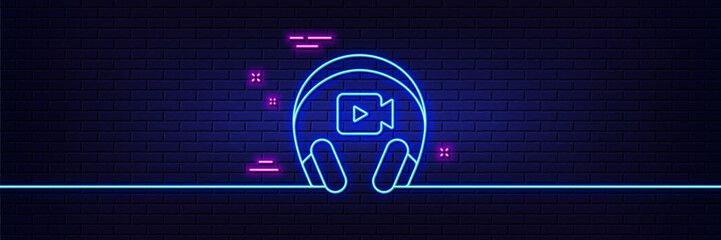 Neon light glow effect. Headphones with video camera line icon. Online conference sign. Virtual education symbol. 3d line neon glow icon. Brick wall banner. Headphones outline. Vector