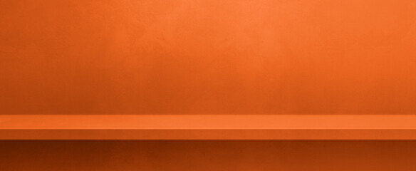 Empty shelf on a neon orange concrete wall. Background template. Horizontal banner mockup