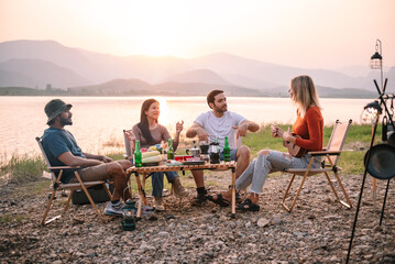 Group of friends at campground, Camping tent with friends, Diverse people hangout together at camp...