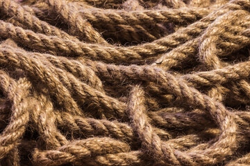 Abstract ropes, cables, hems background, Tangled rope rope background. Jute rope. Shot up close