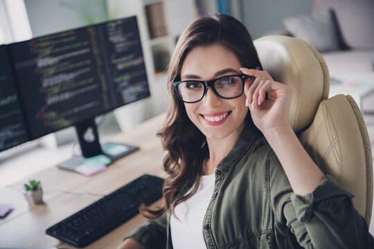 Photo of smiling intelligent lady software expert nerd sit chair modern office write content plan report removal bug indoor workstation