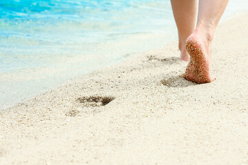 beautiful footprints in the sand by the sea background