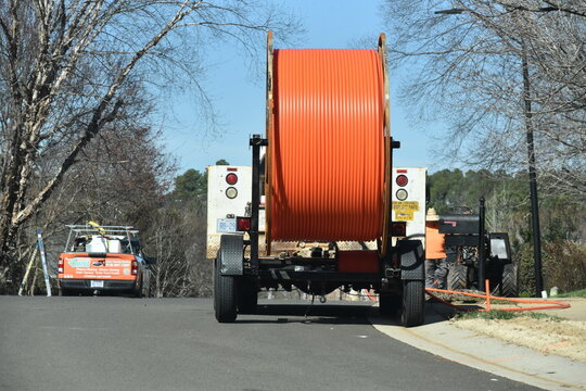 Utility equipment in a residential neighborhood in preparation of fiber optic internet deployment. 