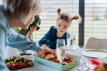 Happy multigenertional family having Easter dinner together.