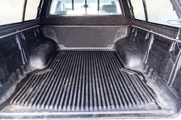The body space of the trunk of a car in the back of a pickup truck for transporting goods like on a...