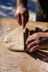 the process of cutting dough for dumplings,open-air kitchen