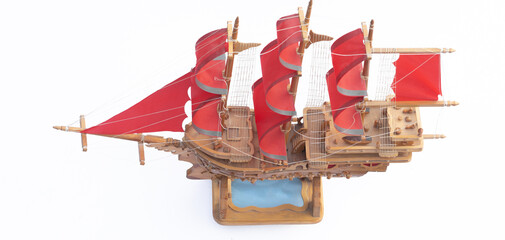 ship model with red sails isolated on white background