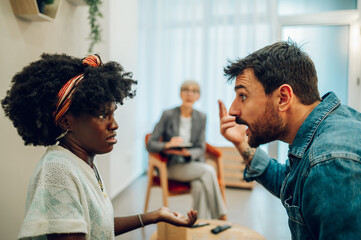 Diverse couple on a therapy session in a psychologist office