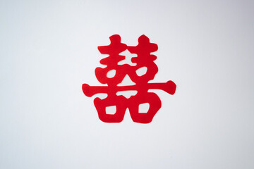 Paper cutting red Chinese wording in the meaning of "Double Happiness" .in isolated white background. This is commonly use for Chinese wedding event