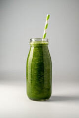 Bottle of green apple and banana smoothie, detox smoothie shake drink