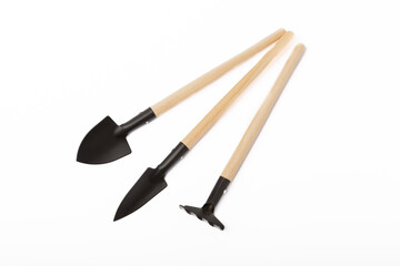 Garden tools isolated on white background. Garden shovel and rake.