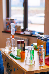 on the table there are various devices for conducting experiments, water, test tubes and other means