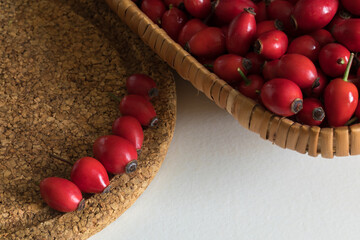 Ripe rose hips harvested for making preserves for the winter, close-up. Healthy eating.