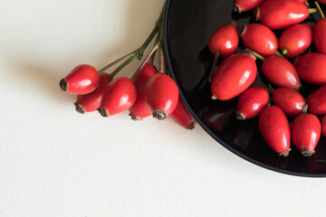 Ripe rose hips harvested for making preserves for the winter, close-up. Healthy eating.