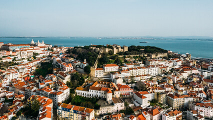 Aerial drone view of St. George Castle in Lisbon, Portugal with surrounding cityscape