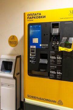 Moscow, Russia - February 13, 2023: parking payment machine in underground garage of shopping mall