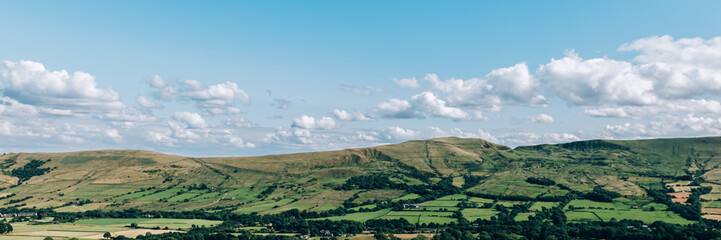 Obraz premium Beautiful field view on Edale village and Mam Tor at Peak District National Park, England, UK. Staycation concept of traveling local, banner size