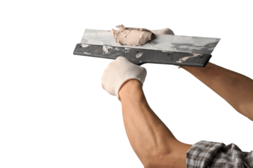 A worker with wall plastering tools for renovating house.