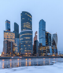 Winter view of the Moscow City business center. Moscow international business center and the river with ice.