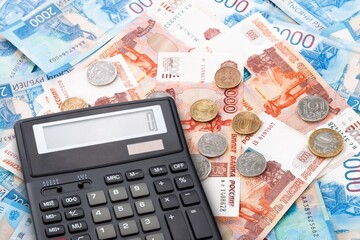 Economy financial concept, calculator on paper currency.