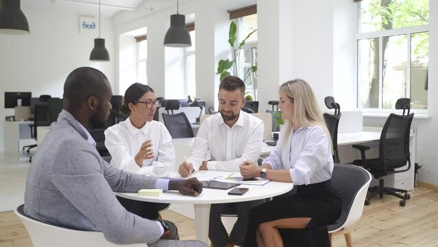 Multi-ethnic business people during meeting in modern office