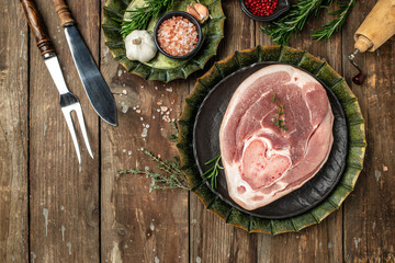 pork leg on a wooden background, banner, menu, recipe place for text, top view