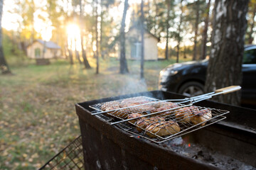 grilled sausages on the background of autumn nature.
