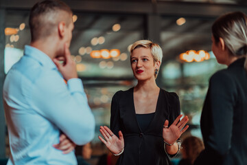 Photo of a business team of young people discussing business ideas in a modern urban environment. Selective focus 