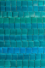 Obraz premium Background of small square tiles in different shades of blue and green